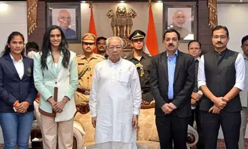 Governor Biswa Bhusan Harichandan after felicitating three Olympians from Andhra Pradesh, PV  Sindhu, E Rajani and Satwik Sairaj Rankireddy, at Raj Bhavan in Vijayawada on Friday