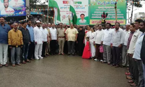 People rendering  the national anthem at a junction in Punganur town of Chittoor district