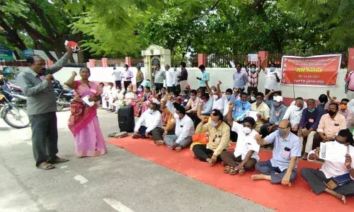 Teachers protest against the merger of some primary classes with high schools at the collectorate in Ongole on Saturday