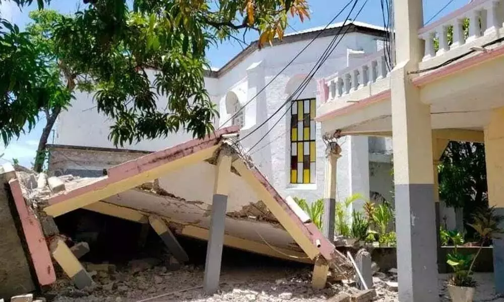 A 7.2-magnitude earthquake in Haiti has killed 304 people, wounded more than 1,800 others and caused a landslide
