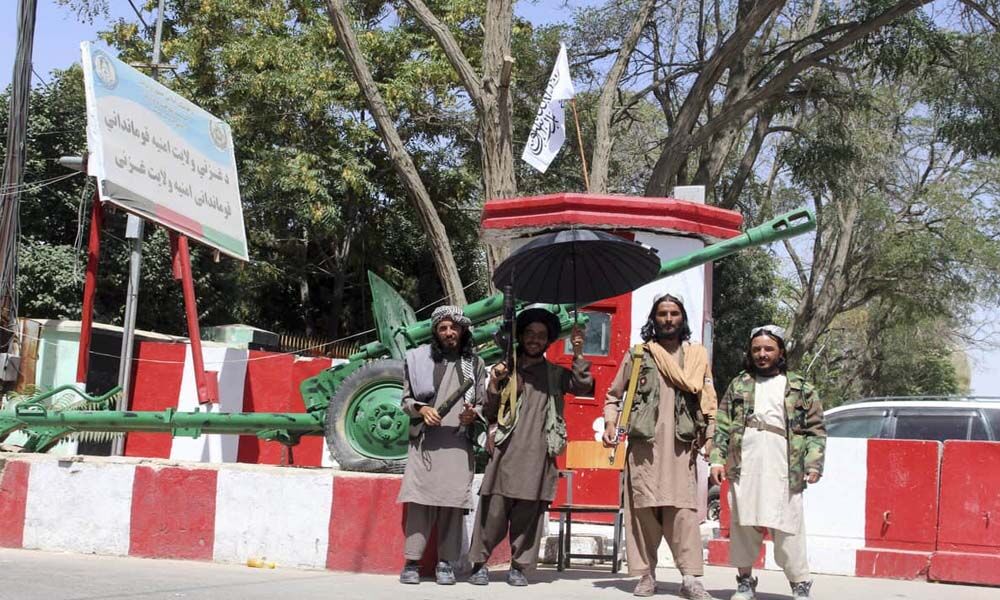 Taliban militants with flags seen on Kabul streets