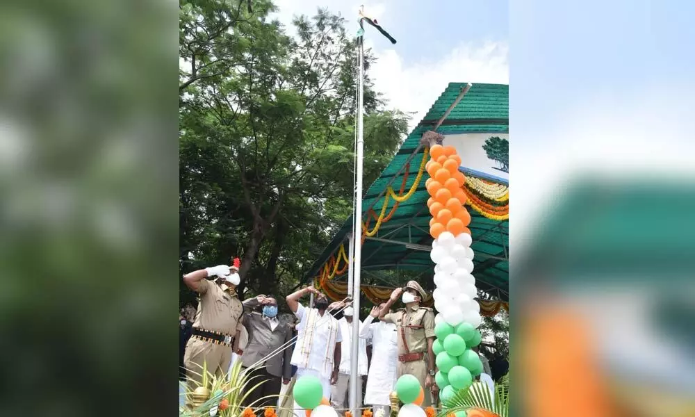 Excise Minister Srinivas Goud and District Collector S Venkat Rao hoisting the national flag in Mahbubnagar on Sunday