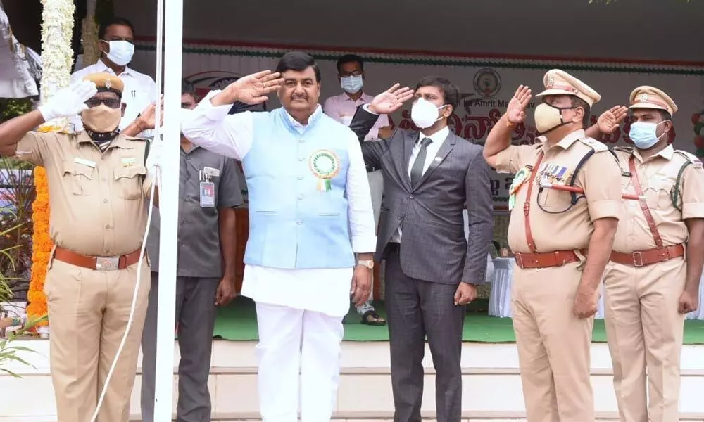 Deputy Chief Minister Dharmana Krishna Das and others saluting national flag at I-Day celebrations in Kakinada on Sunday