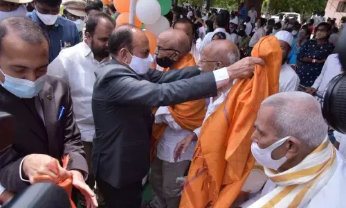 Home Minister Mahmood Ali felicitating freedom fighters during 75th Independence Day celebrations at Nalgonda on Sunday
