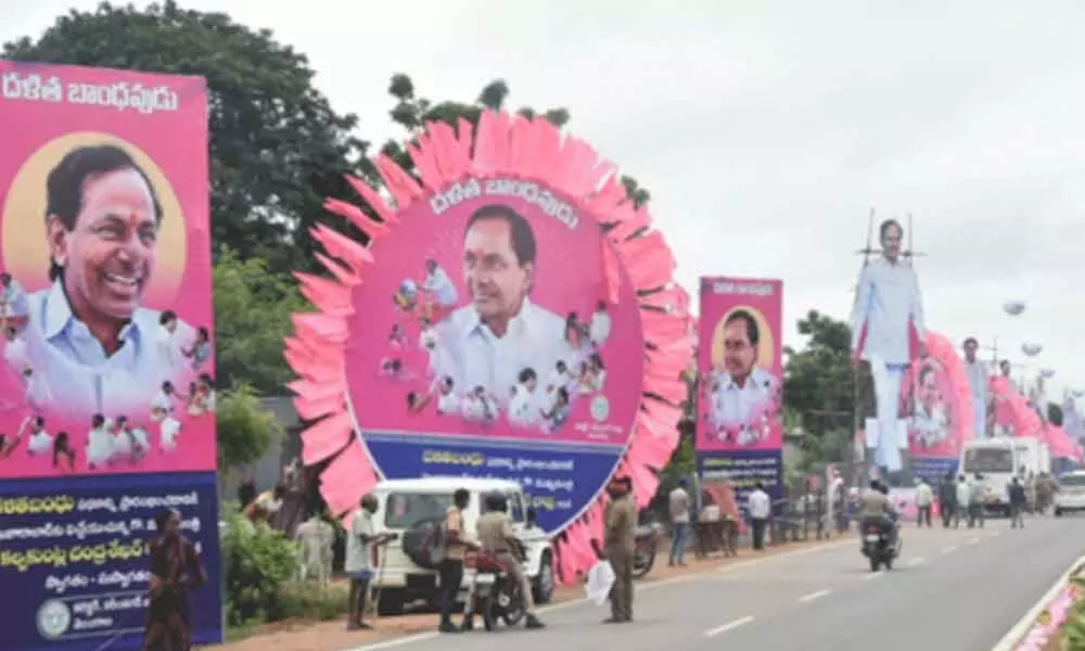 Jammikunta village turned pink with the hoardings to the ruling party welcoming the party chief