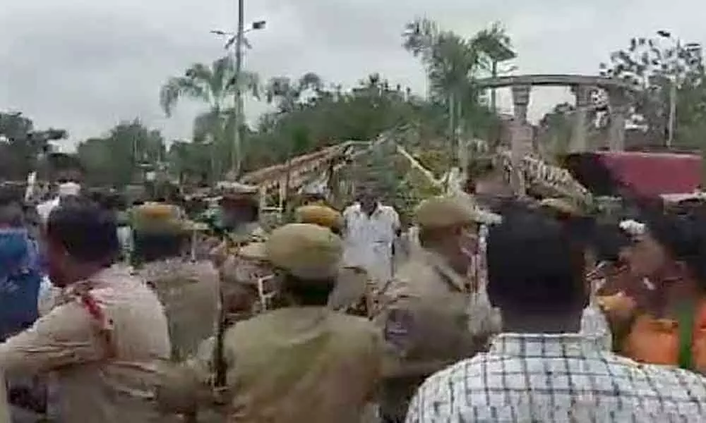 Tension prevailed in Sircilla as TRS and BJP leaders clashed at Ambedkar X roads in Sircilla town