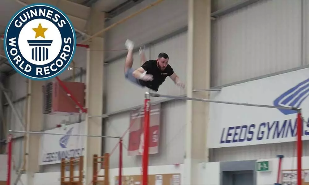 A Guinness World Record For The ‘Farthest Backflip Between Horizontal Bars
