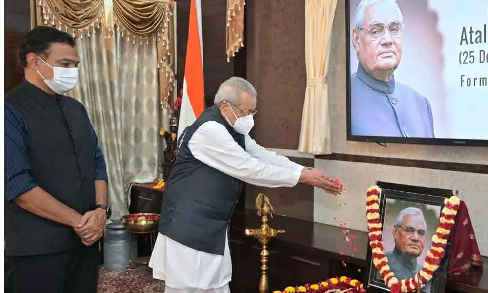 Governor  Biswa Bhusan Harichandan paying floral tributes to the late Prime Minister Atal Behari Vajpayee at Raj Bhavan in Vijayawada on Monday