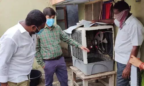 Municipal Commissioner Anurag Jayanthi observing water stagnated in a water cooler in a house in Khammam on Tuesday