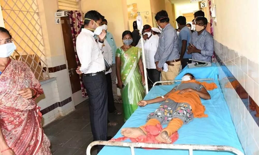 District Collector D Anudeep interacting with a patient at government hospital in Kothagudem