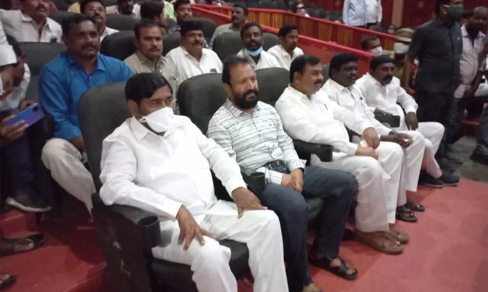 Minister Jagadish Reddy along with local people’s representatives watching ‘Rythanna’ movie in a theatre in Suryapet on Wednesday