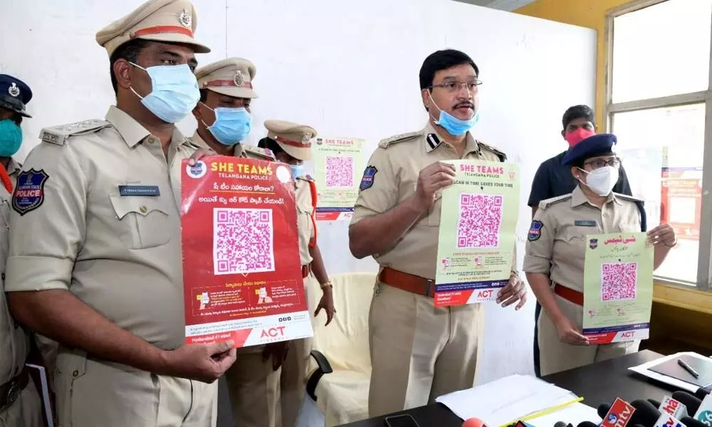 SP Ranganath and Additional SP Narmada unveiling QR code leaflets at SHE police station in Miryalaguda on Wednesday