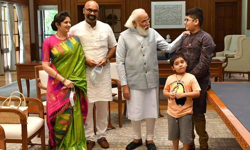 Prime Minister Narendra Modi interacting with the MP family at the PM’s residence in New Delhi on Wednesday