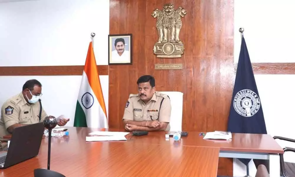 SP M Ravindranath Babu addressing a videoconference with officials in Kakinada on Wednesday