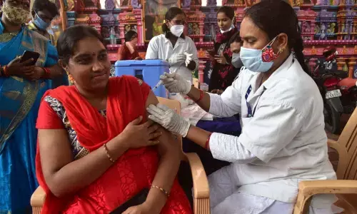 A medic administers Covid vaccine to a woman at Mahankali temple in Secunderabad on Wednesday  Photo: Adula Krishna