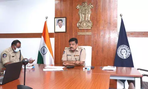 SP M Ravindranath Babu addressing a videoconference with officials in Kakinada on Wednesday