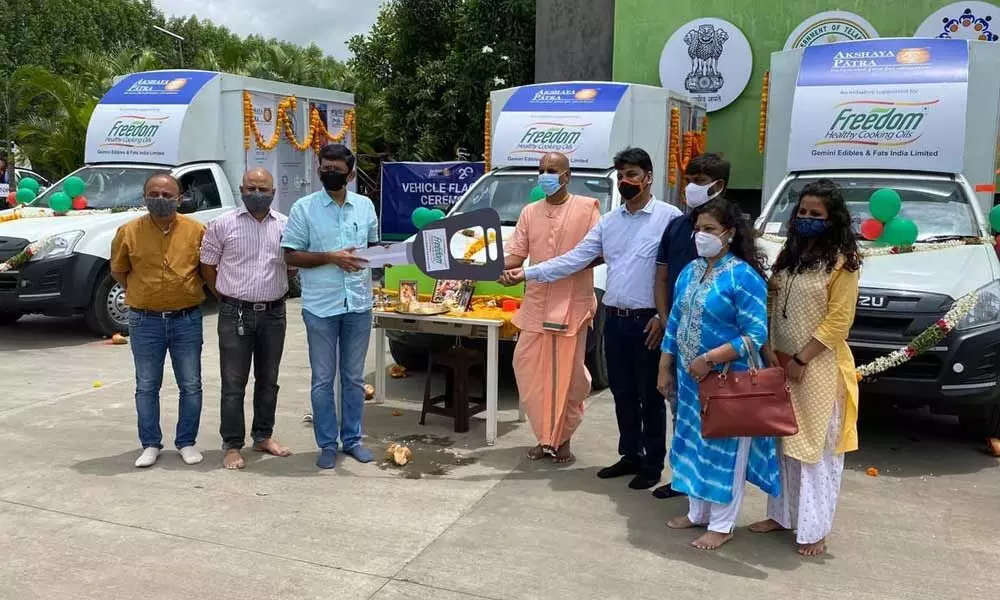 Representatives of GEF India handing over three food delivery vehicles to Akshaya Patra Foundation officials at Kandi on Thursday