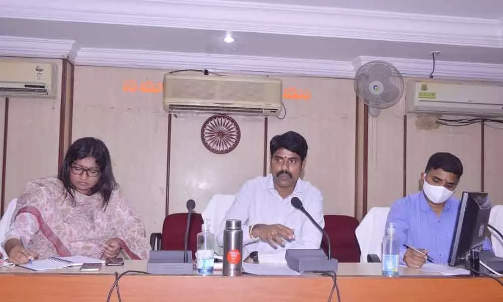 Collector Narayana Reddy addressing a meeting in Mopal on Saturday