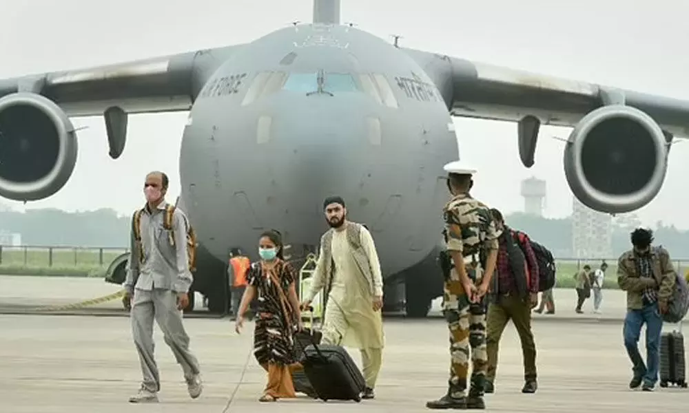 People who were stranded in crisis-hit Afghanistan arrive by a special repatriation flight of IAF at the Hindan Air Force Station, in Ghaziabad, Sunday, Aug. 22, 2021. (Photo | PTI)