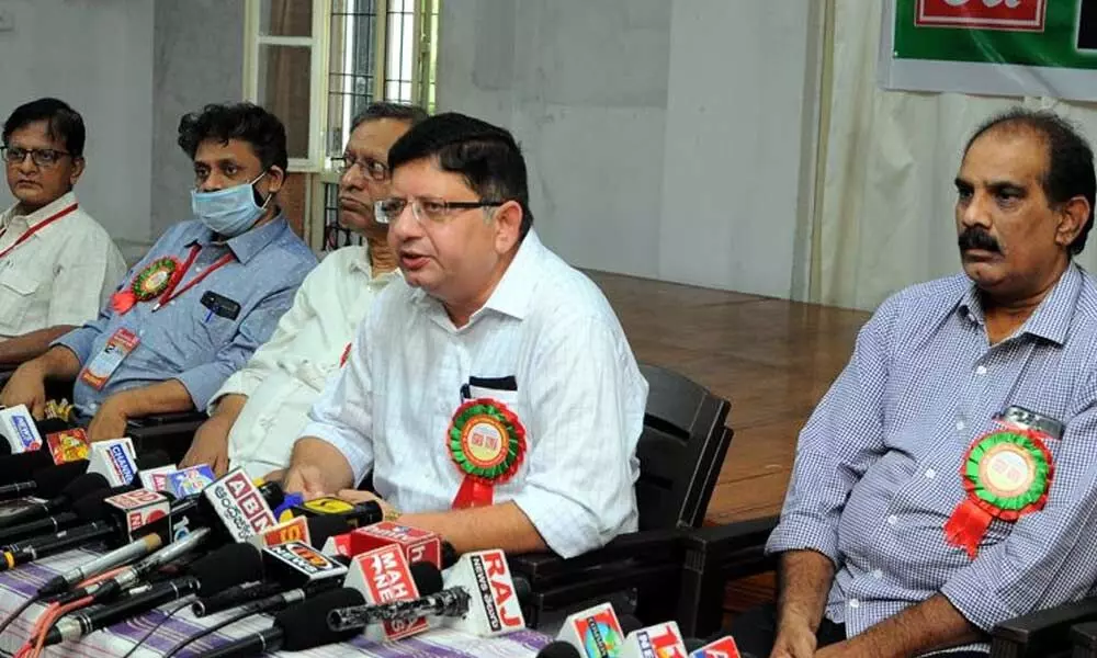 AIIEA general secretary Shreekanth Mishra addressing the media in Vijayawada on Sunday