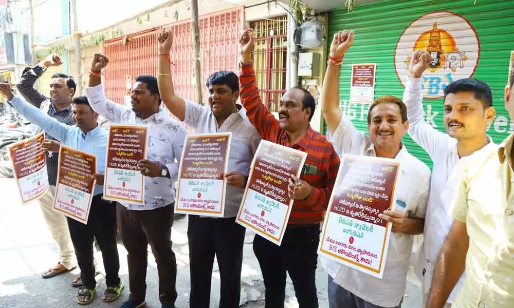 Representatives of Jewellery Association staging a protest against hallmarking of ornaments at Chinna Bazar Street in Tirupati on Monday