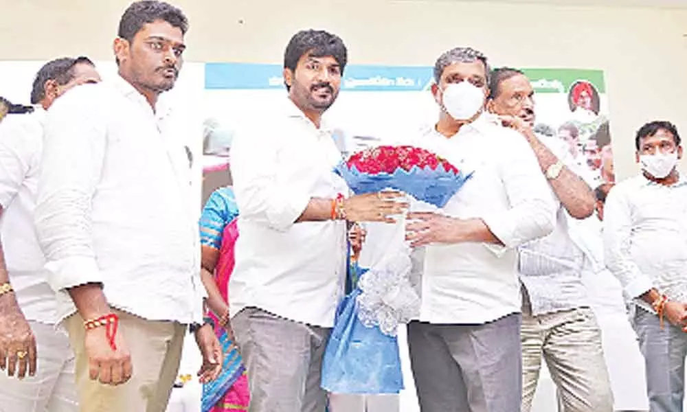 Government Advisor Sajjala Ramakrishna Reddy felicitating B Krishna Chaitanya on the occasion of the latter taking charge as the chairman of SAPNET in Tadepalli on Monday