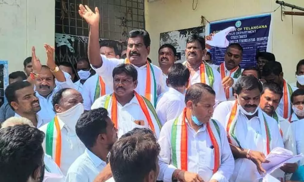 Congress leaders stage protest near Tahsildar Office at Devaruppula in Jangaon district on Monday
