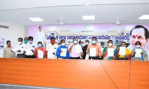 District Collector A Sarath with others unveiling deworming campaign pamphlets in Kamareddy on Monday