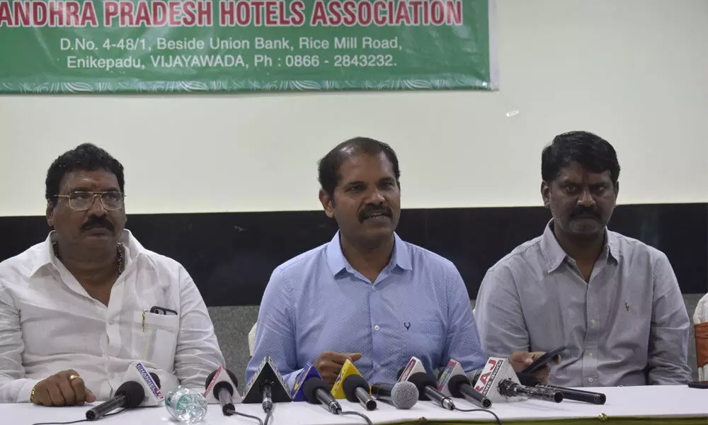 AP Hotels Association president M Balakrishna Reddy addressing a press conference  in Vijayawada on Wednesday