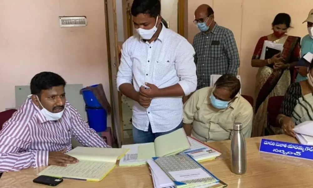 District Collector Amoy Kumar inspecting registers at Kawadipally GP office and nursery on Thursday