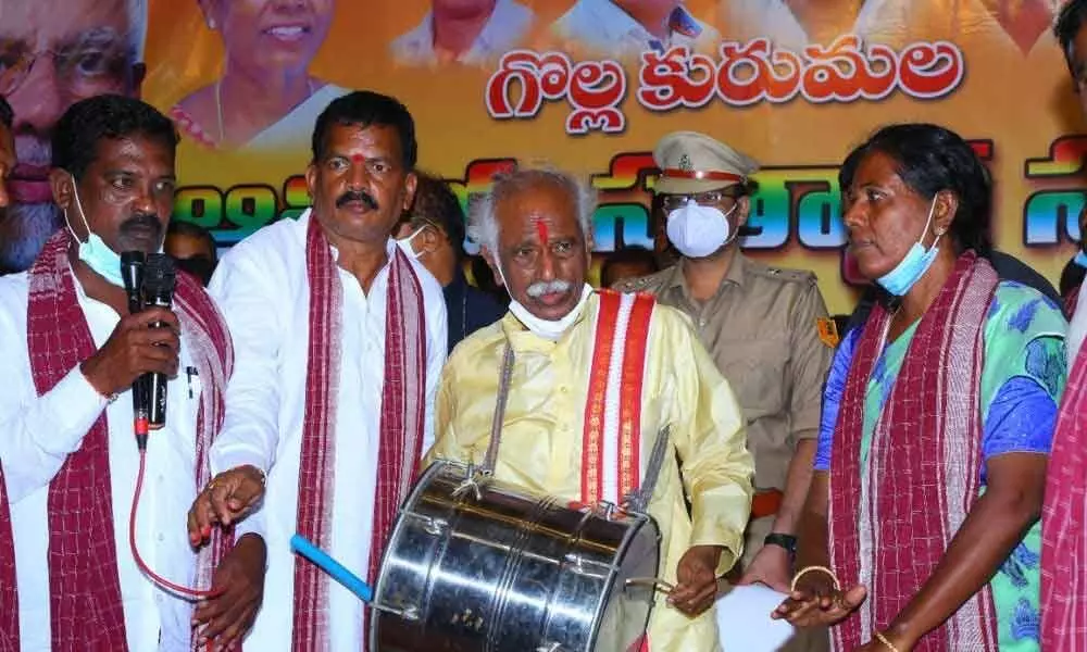 Haryana Governor Bandaru Dattatreya beating a drum at Golla Kuruma community felicitation programme in Jammikunta town on Thursday