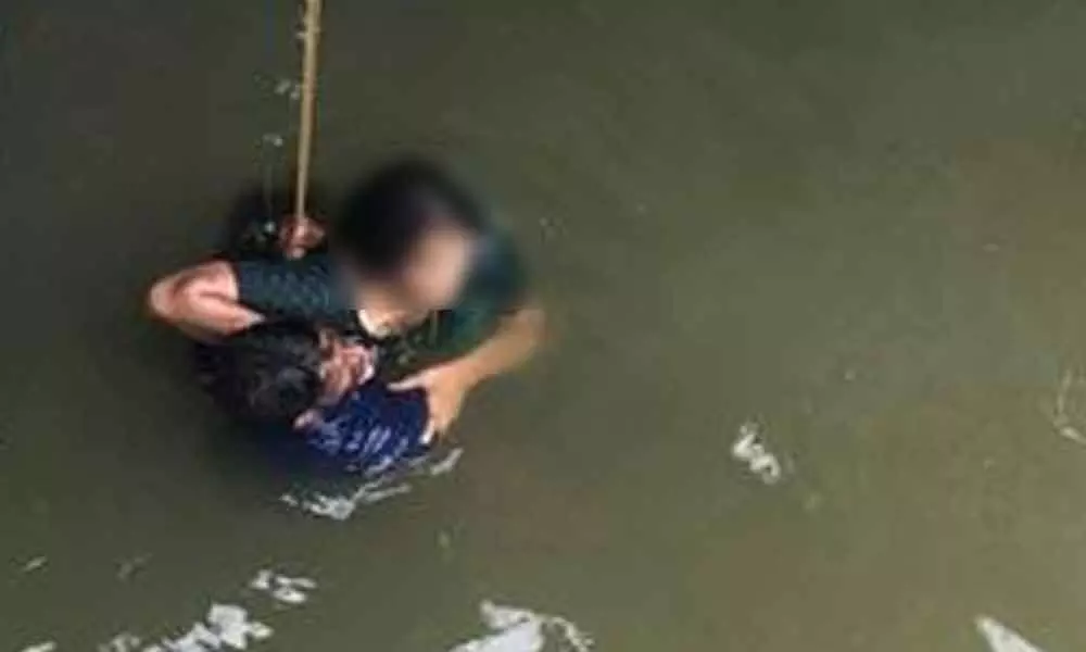 The woman being rescued from Buckingham Canal at Tadepalli in Guntur district on Friday
