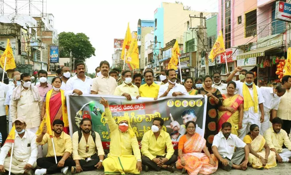TDP leaders staging a protest against increasing fuel prices at Mahilala Mandapam in Tirupati on Saturday