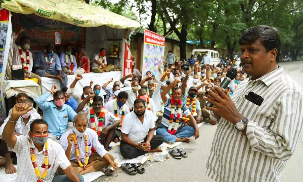 CITU district general secretary K Murali speaking at the dharna of TTD contract forest employees at TTD Forest office in Tirupati on Saturday