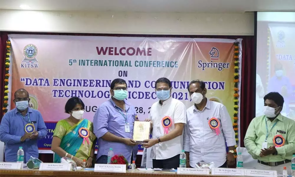 Conference Chair Prof K Ashoka Reddy presenting a memento to the team that organised the meet in Warangal on Saturday