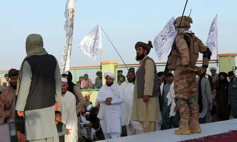 Taliban commando fighters and officials attend a gathering to celebrate their victory in Lashkar Gah, Helmand province in southwestern Afghanistan on Friday