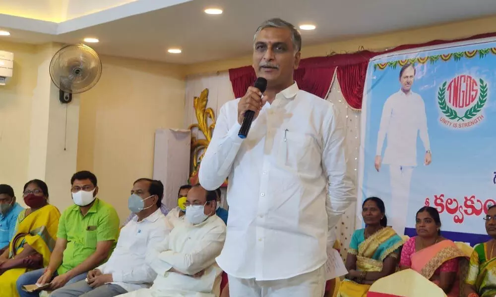 Finance Minister T Harish Rao speaking at the thanks-giving meeting organised by the TNGOs and the Anganwadi staff in Hyderabad on Sunday