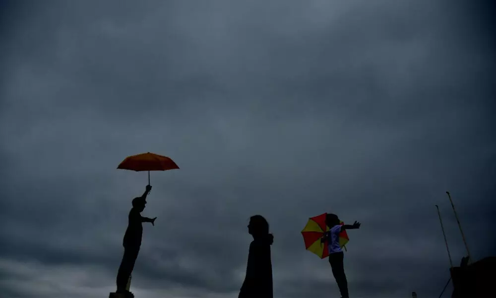 Kids enjoying in the pleasant weather even as the dark clouds threaten to open up in the city on Monday.  Photo :Adula Krishna