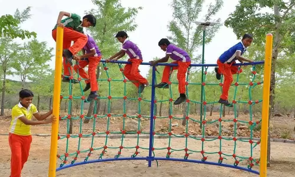 Children playing joyfully in the eco-park