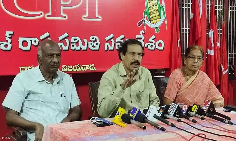 CPI State Secretary K Ramakrishna flanked by P Harinadha Reddy and Akkineni Vanaja addressing the media in Vijayawada on Monday