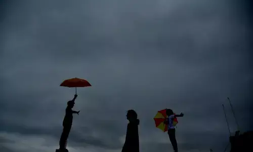 Kids enjoying in the pleasant weather even as the dark clouds threaten to open up in the city on Monday.  Photo :Adula Krishna