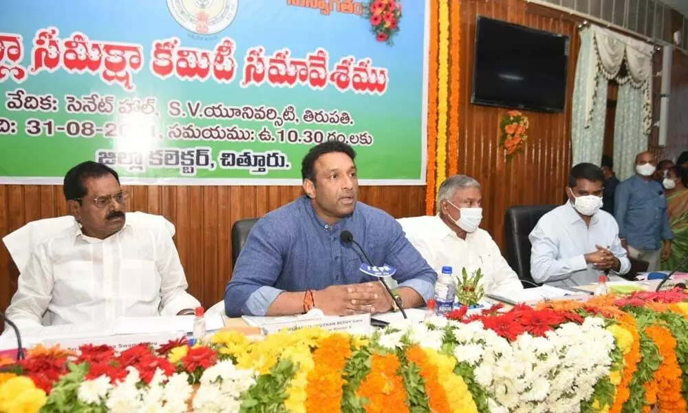 District in-charge Minister Mekapati Gowtham Reddy addressing the DRC meeting at Senate Hall in SV University in Tirupati on Tuesday