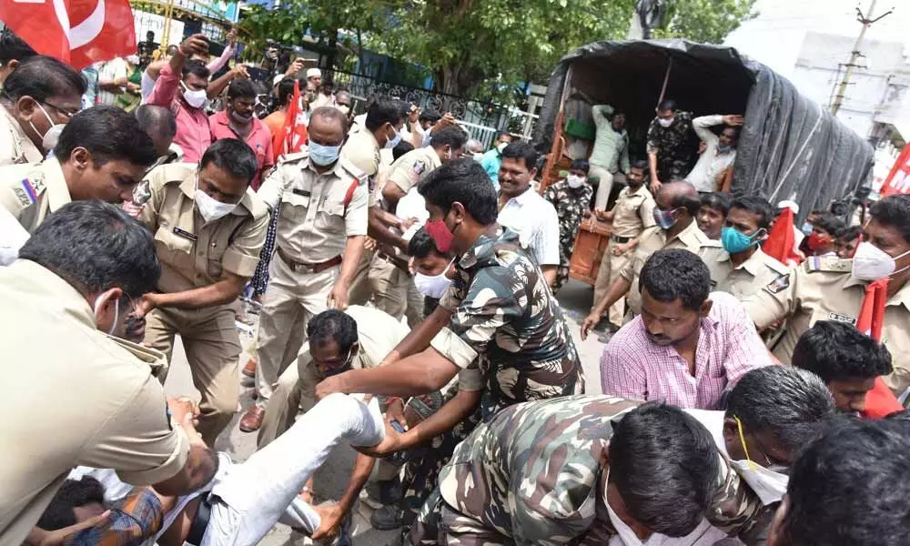 Police lifting CPM leaders, who tried to barge into Kurnool Municipal Corporation office demanding to suspend collection of tax on waste on Tuesday