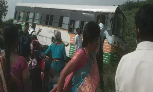 An RTC bus driven into farm fields at Nallakaluva near Laddagiri village on Tuesday