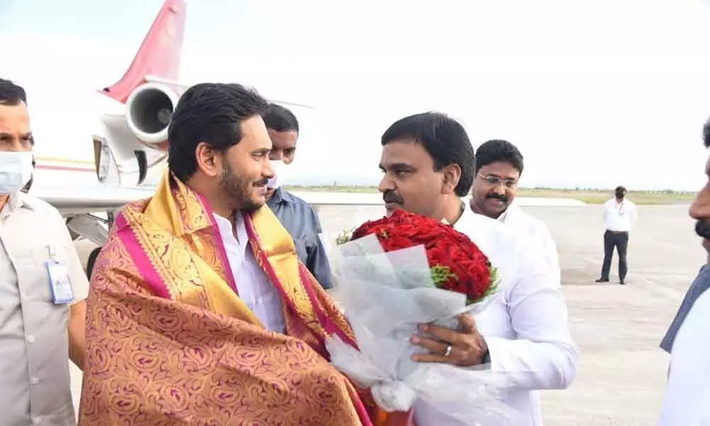 Deputy Chief Minister Amzath Basha receiving Chief Minister Y S Jagan Mohan Reddy at Kadapa airport on Wednesday evening.  Education Minister A Suresh is also seen.