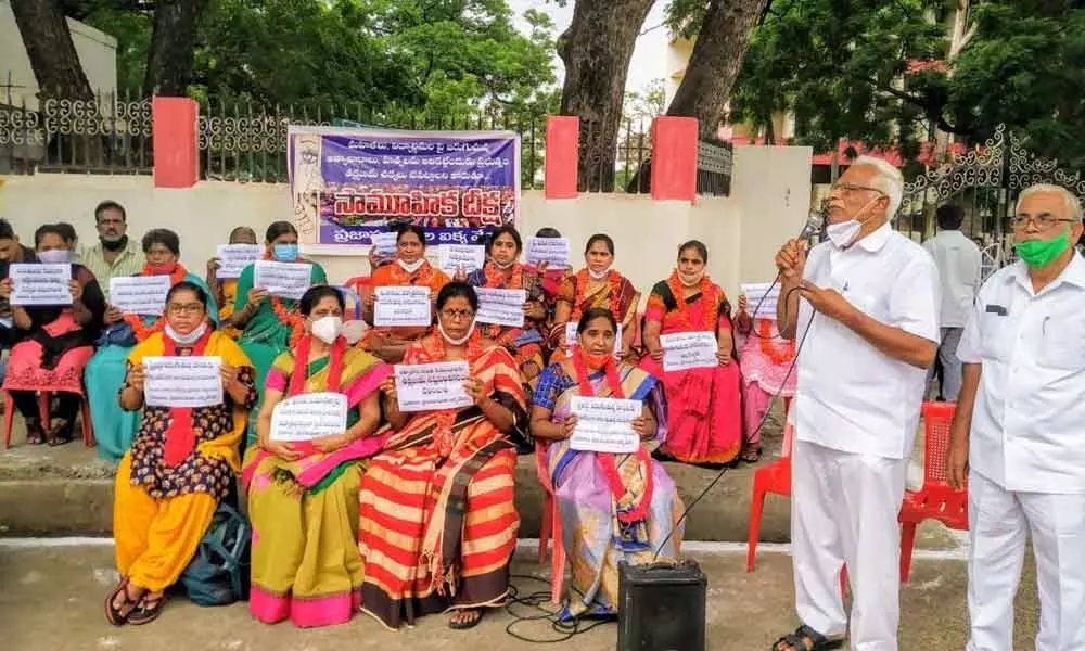 People’s organisations demanding protection to women in Ongole on Wednesday