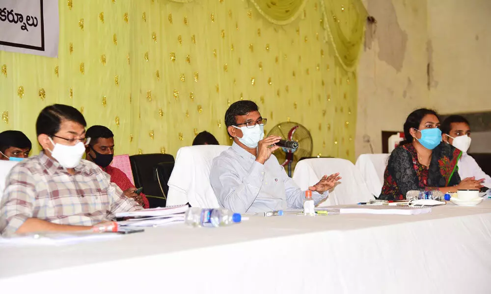 District Collector P Koteshwara Rao holds a review meeting on the construction of houses in Adoni on Thursday.