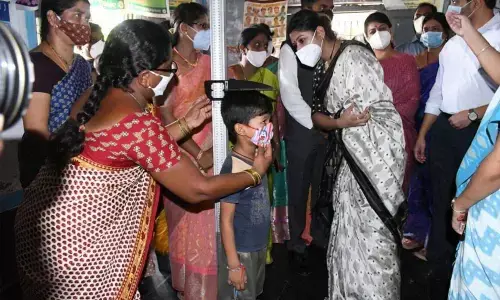 CMO Secretary Smitha Sabharwal observing the height of a student at an Anganwadi centre in Kothagudem district on Thursday
