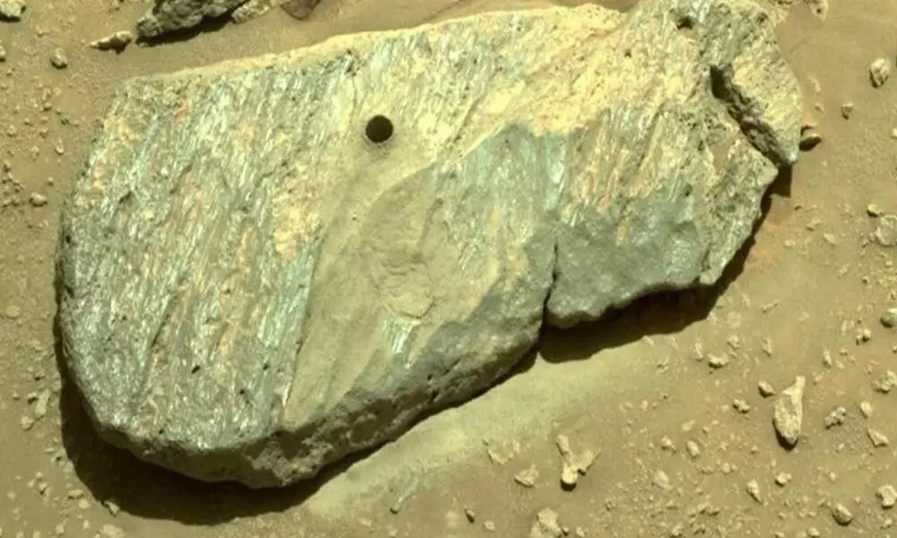 The Martian boulder Rochette now has a perfect drill-hole imprinted in its ancient side. (NASA/JPL-Caltech)