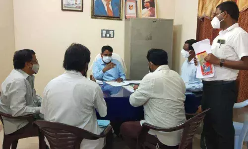 Joint Collector Dr G Lakshmisha holding a meeting on the land acquisition for Sagarmala project